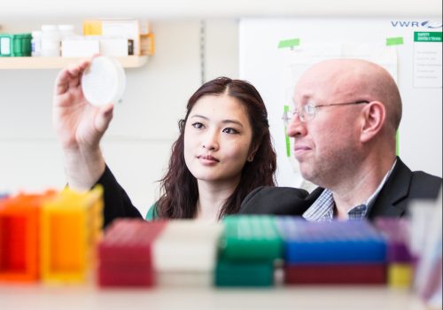 Student in the lab with Ted Meigs