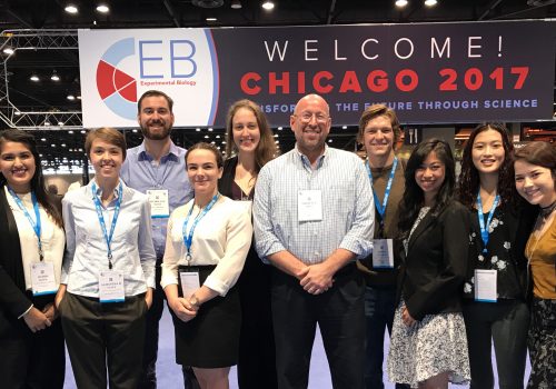 Photo of NC GlaxoSmithKline Scholars and other UNC Asheville students with Dr. Ted Meigs at the Experimental Biology conference in Chicago in April 2017